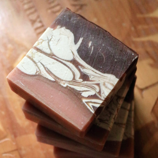 Vegan Chai Tea bar soaps, made of plant-based, cruelty-free ingredients, seen from above on top of a wooden base.