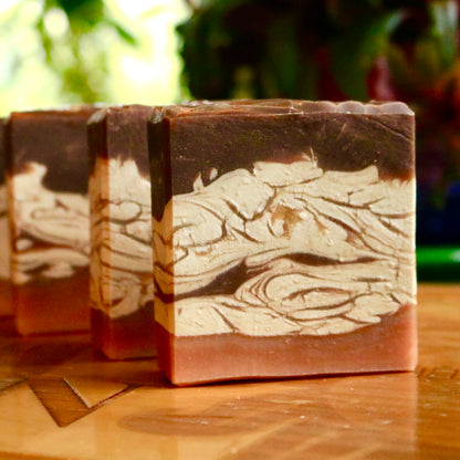 Four bar soaps (vegan and plant-based) seen from the front. Each is approximately 5 oz. in weight and size and is hand-cut and trimmed.